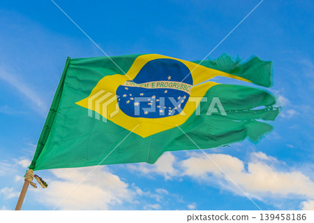 Brazilian flag with blue sky background Rio de Janeiro Brazil. 139458186