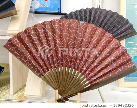 Fans, a symbol of summer, make great gifts, and they have a sophisticated design that's perfect for men. Fans, a symbol of summer, make great gifts, and they have a sophisticated design that's perfect for men. 139458326