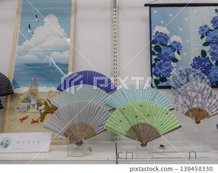 Fans, a symbol of summer, come in a variety of colors and make wonderful gifts. These stylish fans are sure to please. 139458330