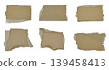 Brown corrugated kraft paper torn into pieces isolated on white background 139458413