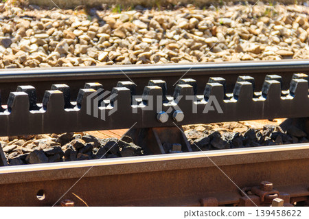 Close-up of the cogwheel railway tracks Close-up of the cogwheel railway tracks 139458622