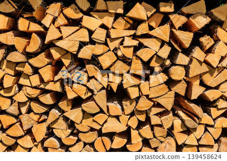 Background of the stacked dry chopped firewood Background of the stacked dry chopped firewood 139458624