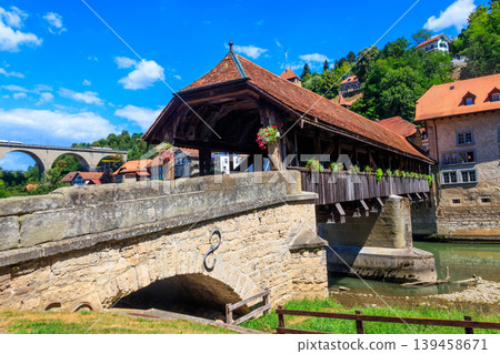 Berne Bridge (Pont de Berne) across the Sarine river in the lower town of Fribourg, Switzerland Berne Bridge (Pont de Berne) across the Sarine river in the lower town of Fribourg, Switzerland 139458671