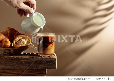 Coffee latte with croissants on an old wooden table. Coffee latte with croissants on an old wooden table. 139458910
