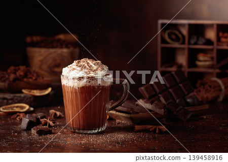 Hot chocolate topped with whipped cream and sprinkled with chocolate chips. Hot chocolate topped with whipped cream and sprinkled with chocolate chips. 139458916
