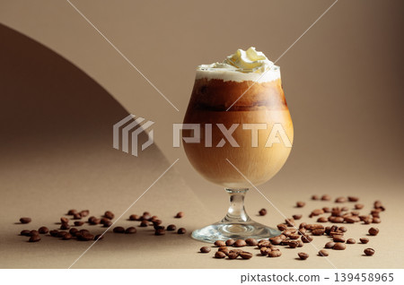 Cream and coffee cocktail on beige background. Cream and coffee cocktail on beige background. 139458965