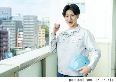 A male worker inspecting equipment. A male worker inspecting equipment. 139459314