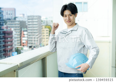 A male worker inspecting equipment. A male worker inspecting equipment. 139459315