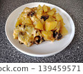 Baked potatoes with mushrooms and melted cheese. 139459571