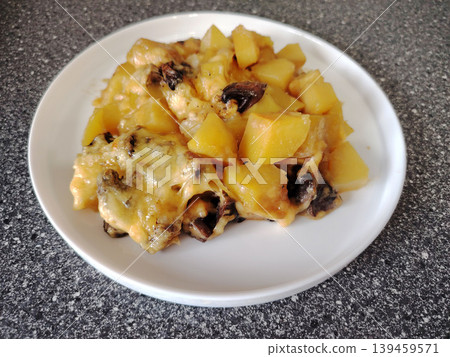 Baked potatoes with mushrooms and melted cheese. Baked potatoes with mushrooms and melted cheese. 139459571