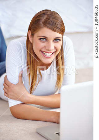 Woman, remote work and portrait with laptop on floor of home to update blog post, social media and digital subscription. Happy freelancer relax with computer for online shopping, email and research Woman, remote work and portrait with laptop on floor of home to update blog post, social media and digital subscription. Happy freelancer relax with computer for online shopping, email and research 139460635