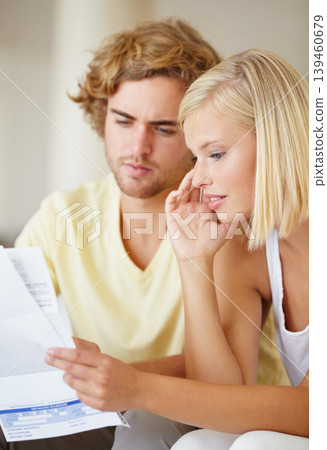 Paper, finance and couple with documents in a house for future planning, investment or asset management. Paperwork, insurance and people in a living room for bills, mortgage or home loan application Paper, finance and couple with documents in a house for future planning, investment or asset management. Paperwork, insurance and people in a living room for bills, mortgage or home loan application 139460679