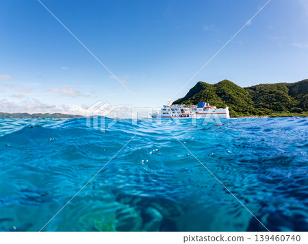 A half-submerged photo of Aka Beach on Aka Island. A ferry is passing in the distance. Aka Beach (Majyahama), Kerama Islands, Shimajiri District, Okinawa Prefecture 139460740