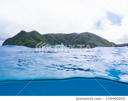 A half-submerged photo of Aka Beach on Aka Island. A ferry is passing in the distance. Aka Beach (Majyahama), Kerama Islands, Shimajiri District, Okinawa Prefecture A half-submerged photo of Aka Beach on Aka Island. A ferry is passing in the distance. Aka Beach (Majyahama), Kerama Islands, Shimajiri District, Okinawa Prefecture 139460808