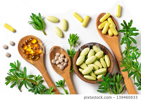Natural herbal vitamins, plant based supplements and green leaves Natural herbal vitamins, plant based supplements and green leaves 139460833