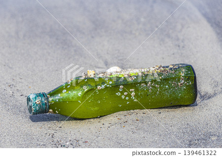 Plastic bottle stranded washed up garbage pollution on beach Brazil. Plastic bottle stranded washed up garbage pollution on beach Brazil. 139461322