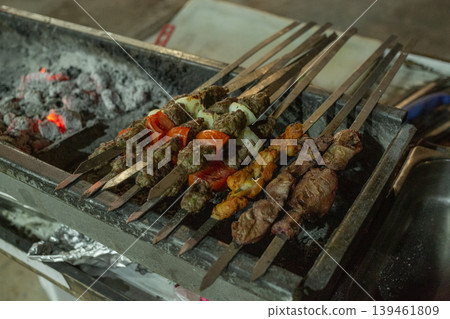 [Jerusalem] Kebab skewers grilled over charcoal on the street at night in front of the Old City 139461809