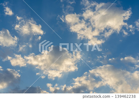 A close-up of clouds shining in the clear blue sky and morning sun on a cold winter morning 01 A close-up of clouds shining in the clear blue sky and morning sun on a cold winter morning 01 139462238