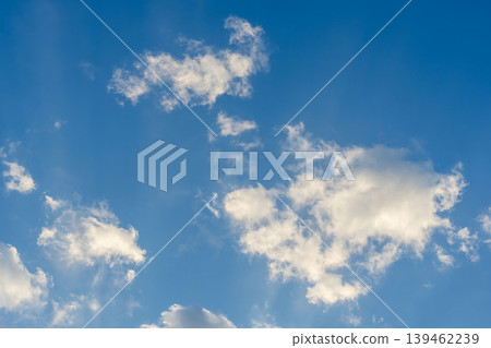 A close-up of clouds shining in the clear blue sky and morning sun on a cold winter morning (02) A close-up of clouds shining in the clear blue sky and morning sun on a cold winter morning (02) 139462239