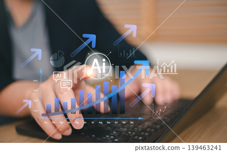 Business professional using AI technology to analyze data financial growth charts on laptop. Concept of artificial intelligence, digital transformation, futuristic marketing and profit increase 139463241