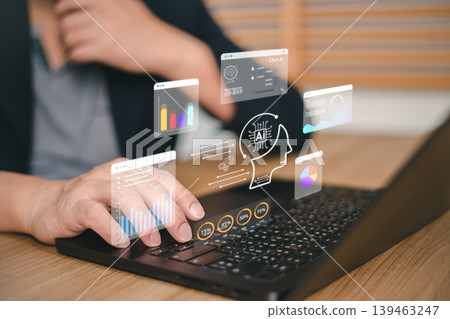 Professional businessman using laptop with AI artificial intelligence icon and digital data dashboard. Concept of big data analysis, machine learning technology, and futuristic business software Professional businessman using laptop with AI artificial intelligence icon and digital data dashboard. Concept of big data analysis, machine learning technology, and futuristic business software 139463247