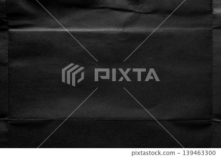 Black paper texture with a fold structure that creates a natural central frame from folds and creases of old unfolded poster. Dark minimalist background for mockups or layouts Black paper texture with a fold structure that creates a natural central frame from folds and creases of old unfolded poster. Dark minimalist background for mockups or layouts 139463300
