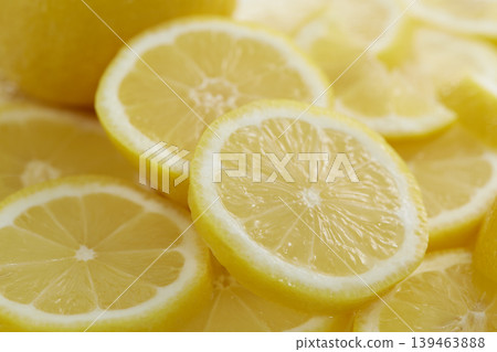 Fresh lemons placed against a white background Fresh lemons placed against a white background 139463888