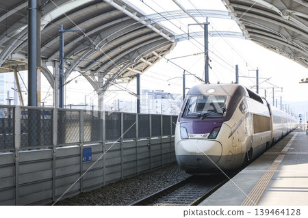 An SRT high-speed train arriving at Osong Station on the Gyeongbu Line. An SRT high-speed train arriving at Osong Station on the Gyeongbu Line. 139464128