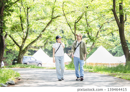 A couple walking in the fresh green A couple walking in the fresh green 139464415