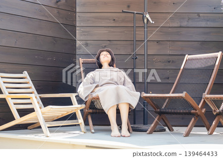 Woman enjoying the sauna Woman enjoying the sauna 139464433