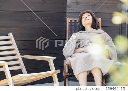 Woman enjoying the sauna Woman enjoying the sauna 139464435