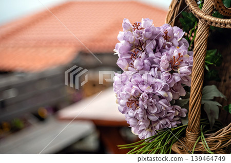 Flowers in a basket are displayed in Skopje, North Macedonia during a sunny day Flowers in a basket are displayed in Skopje, North Macedonia during a sunny day 139464749