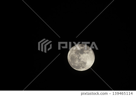 Close-up of the moon floating in the early spring night sky 18 Close-up of the moon floating in the early spring night sky 18 139465114