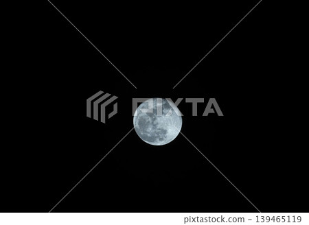 Close-up of the moon floating in the early spring night sky 23 Close-up of the moon floating in the early spring night sky 23 139465119
