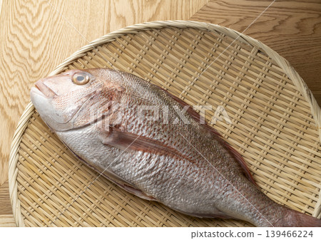Sea bream served on a bamboo basket Sea bream served on a bamboo basket 139466224