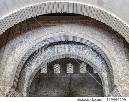 Ornate Islamic Arch Interior With Carved Stucco, Muqarnas Vaulting and Decorative Arabic Motifs, Alhambra, Granada Ornate Islamic Arch Interior With Carved Stucco, Muqarnas Vaulting and Decorative Arabic Motifs, Alhambra, Granada 139466299