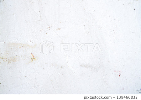 Plaster applied on a wall surface prepared for repair with visible texture and uneven layers. Construction process, home renovation, and maintenance work scene. 139466832
