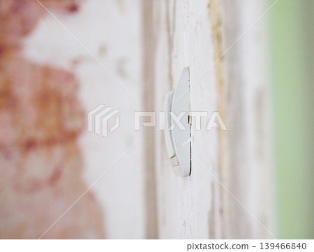 Unfinished room with scratched wall surfaces coated in fresh plaster. Ideal for home improvement, construction industry, and renovation concepts. 139466840