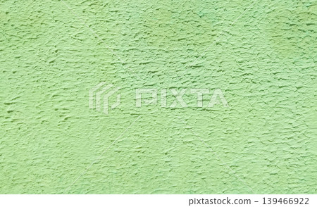 Soft green textured concrete wall with distressed and weathered finish. Can be used as a background for urban design, branding, and digital artwork. Soft green textured concrete wall with distressed and weathered finish. Can be used as a background for urban design, branding, and digital artwork. 139466922