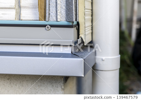 Construction work on the lower edge of the exterior wall next to the entrance; renovation work around the foundation. Construction work on the lower edge of the exterior wall next to the entrance; renovation work around the foundation. 139467579