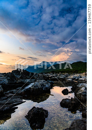 The evening sky of Yakushima reflected in the tide pools 139467759