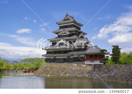 Matsumoto Castle standing under a blue sky Matsumoto Castle standing under a blue sky 139468017