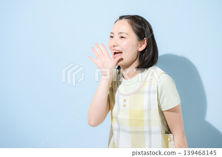 A profile of a woman wearing an apron with a smile, working as a childcare worker, caregiver, or housewife, against a light blue background, along with messages of support and word-of-mouth. A profile of a woman wearing an apron with a smile, working as a childcare worker, caregiver, or housewife, against a light blue background, along with messages of support and word-of-mouth. 139468145