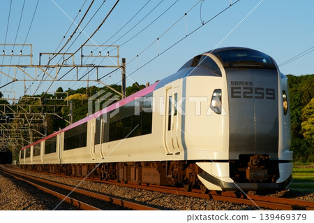 The Limited Express Shiosai illuminated by the setting sun The Limited Express Shiosai illuminated by the setting sun 139469379