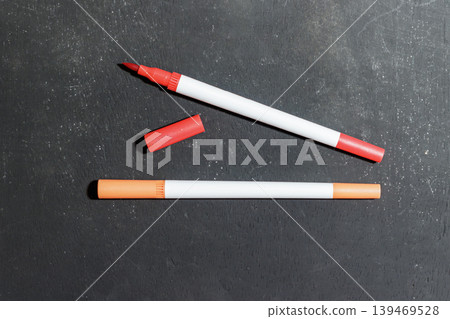 Red and Orange Markers on Dark Background. School and Stationary Supplies. Learning and Education Concept. High quality photo Red and Orange Markers on Dark Background. School and Stationary Supplies. Learning and Education Concept. High quality photo 139469528