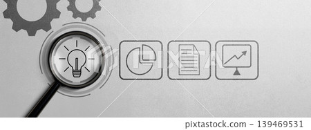 Business Idea Research and Analysis Concept with Magnifying Glass and Financial Icons on Grey Background. Business Concept. High quality photo Business Idea Research and Analysis Concept with Magnifying Glass and Financial Icons on Grey Background. Business Concept. High quality photo 139469531