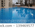 Outdoor swimming pool with clear blue water 139469577