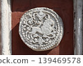 ancient wall bas-relief depicting a lion 139469578