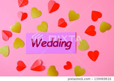 Word wedding on card with hearts background,love concept. Word wedding on card with hearts background,love concept. 139469616