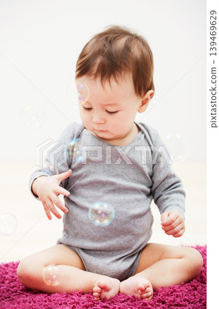 Baby, bubbles and playing game in home for childhood development, curious wondering or education. Kid, growth toys and mockup space or learning progress for sensory, coordination or entertainment Baby, bubbles and playing game in home for childhood development, curious wondering or education. Kid, growth toys and mockup space or learning progress for sensory, coordination or entertainment 139469629